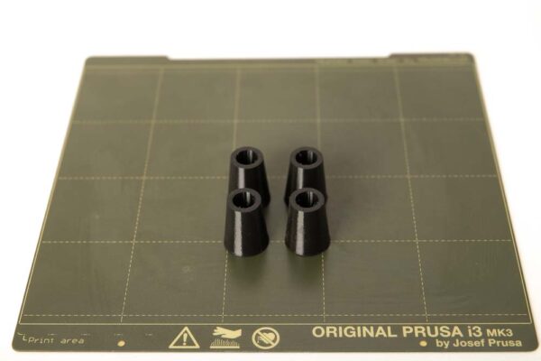 4 pieces of 3D printed flexible damper feet on the flex steel plate of the used 3D printer