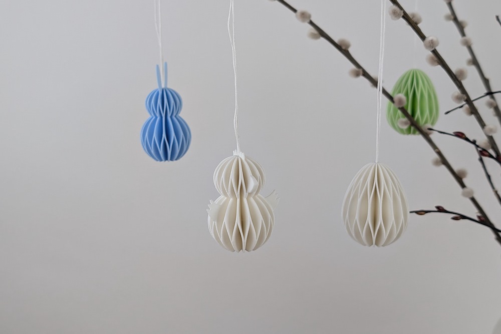 Easter tree with 3D printed Easter eggs, Easter bunnies, and Easter chicks in white, light green, and light blue
