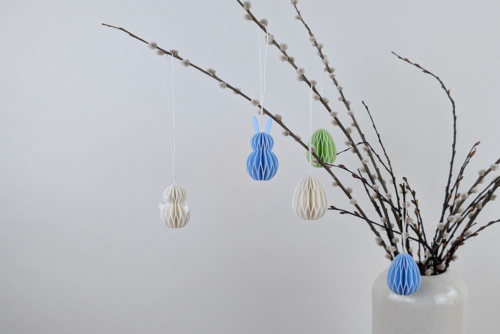 Easter tree with 3D printed Easter eggs, Easter bunnies, and Easter chicks in white, light green, and light blue
