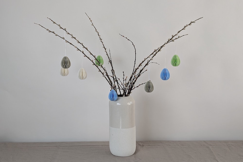 Easter bush with 3D printed Easter eggs in white, light green, and light blue
