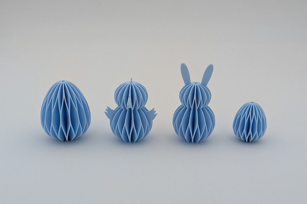 3D printed set of Easter ornaments in a honeycomb design (large egg, chick, bunny, small egg) in light blue