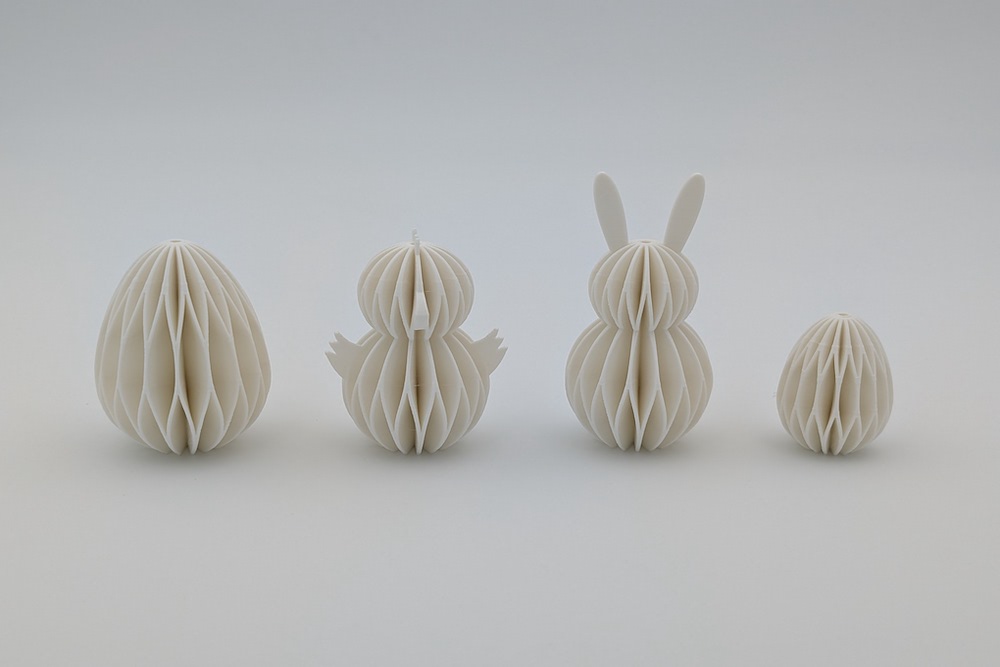 3D printed set of Easter ornaments in a honeycomb design (large egg, chick, bunny, small egg) in the color white

