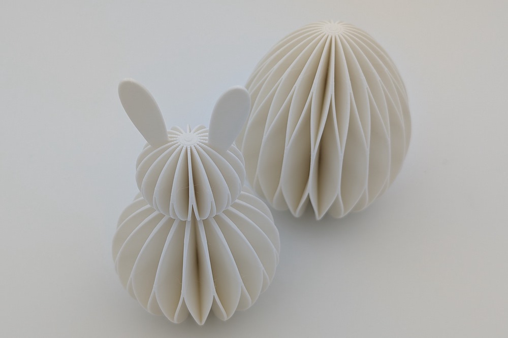 Close-up of a white honeycomb-style Easter decoration set (Easter bunny and Easter egg)