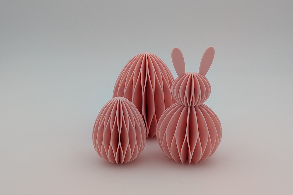 3D printable honeycomb Easter decor set (one Easter bunny and two Easter eggs in various sizes) in pink
